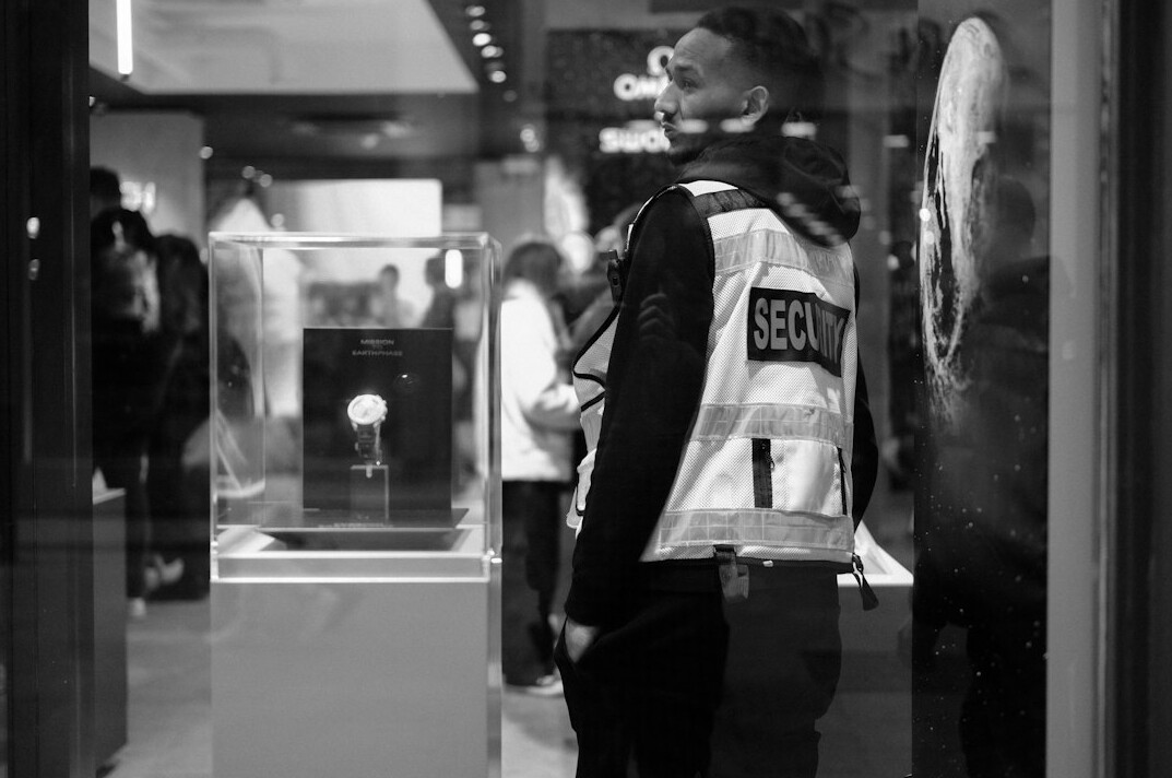 store detective observing customer
