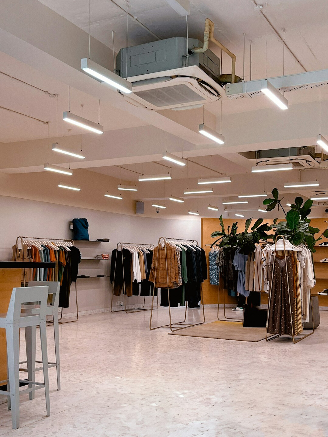 clothing store interior with shoppers