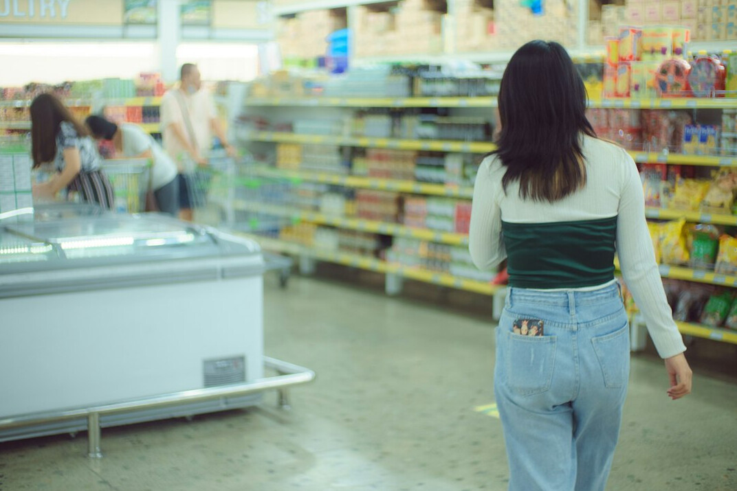 store detective watching shopper