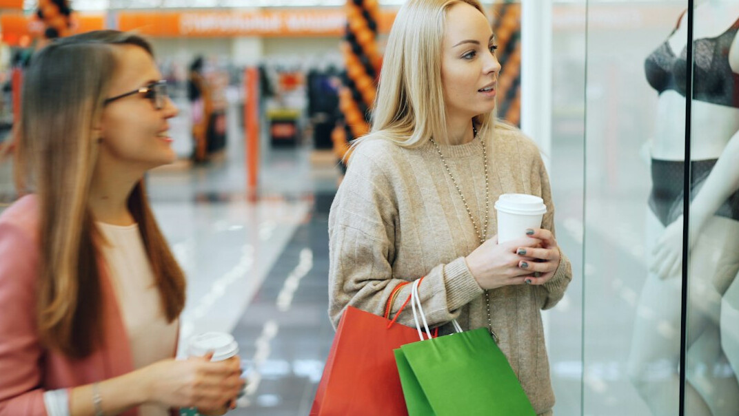 store detective watching shoppers